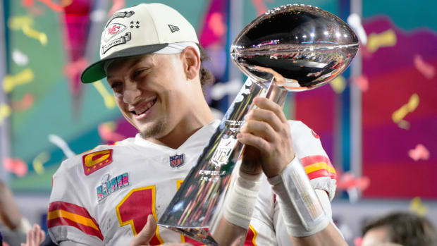 Kansas City Chiefs quarterback Patrick Mahomes (15) holds the trophy after their win against the Philadelphia Eagles in the NFL Super Bowl 57 football game, Sunday, Feb. 12, 2023, in Glendale, Ariz. The Kansas City Chiefs defeated the Philadelphia Eagles 38-35. (AP Photo/Matt Slocum)